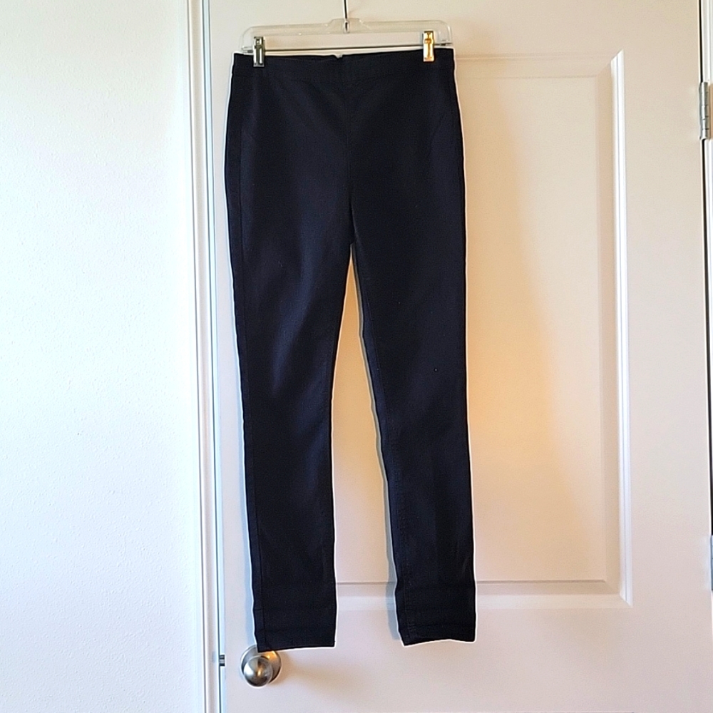 Divided black slim back zip pants